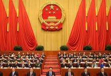 人民日報(bào)社論：以制度筑自信 以民主聚人心